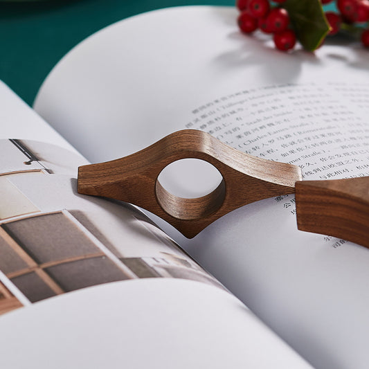 Book Pages Holding Finger Ring